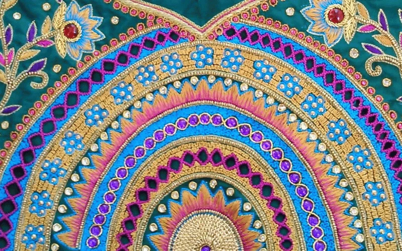 Hand embroidery artwork showcasing intricate Aari and Zardozi craftsmanship by NAYAM design studio